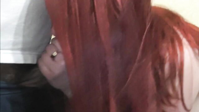 Redhead with long hair in close-up blowjob cum play scene