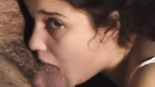 Brunette woman with teary eyes giving intense close-up blowjob