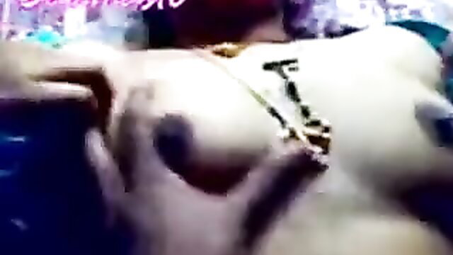 Desi Indian woman topless closeup with razor clamps on big tits