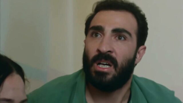 Turkish man with beard in shocked expression in BDSM scene