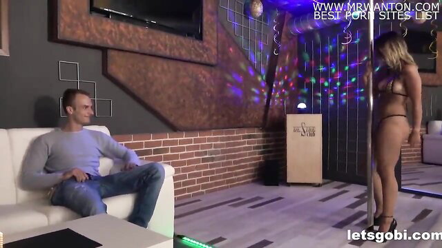 Blonde babe in thong bikini gives hot striptease on pole for man