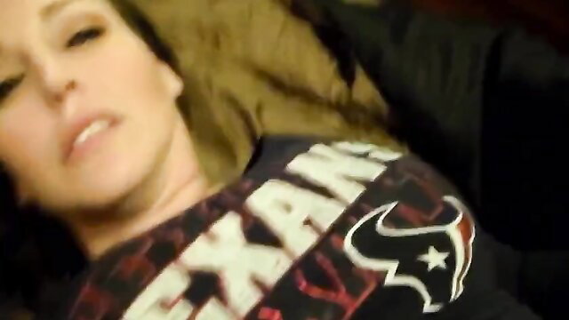 Marie in Houston Texans shirt, lying back seductively for creampie