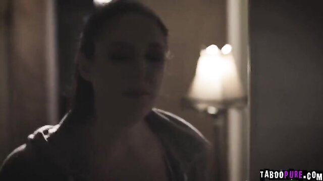 Brunette Tommy in dim light, seductive gaze, wife dominatrix scene