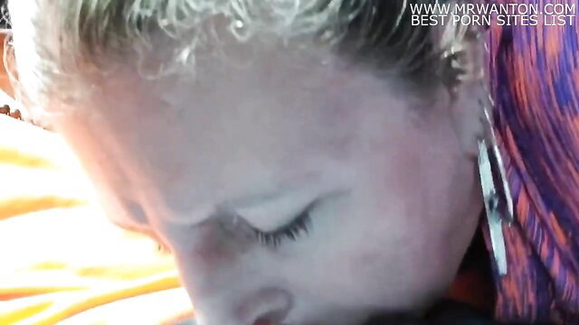 Closeup of mature blonde co-worker sucking dick at work