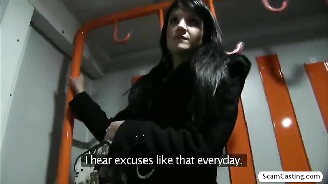 Hot brunette Penelope in black coat on public train grabs bar
