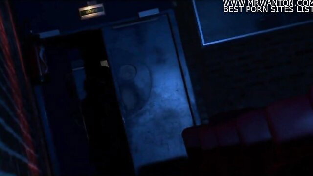 Dark theater room with red seats and glowing yin-yang door in anal movie scene