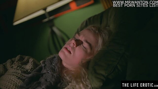 Stunning blonde drenched in sweat masturbates to orgasm on bed