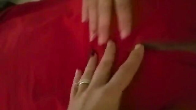 Woman's hands in red lingerie fingering wet pussy closeup