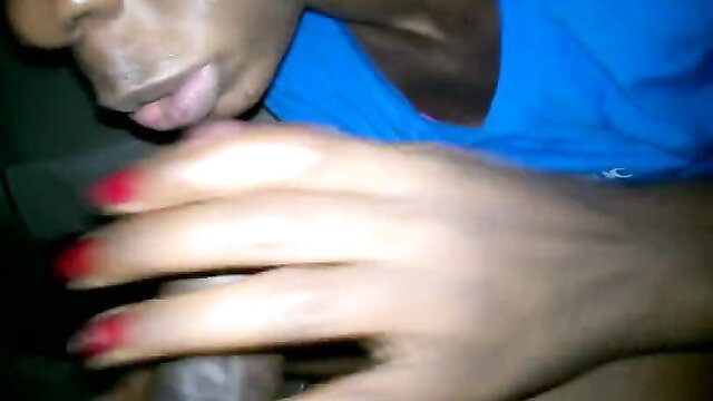 Black woman with red nails sucking big black cock closeup