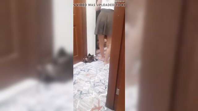 Asian amateur woman bare feet upskirt in doorway, teasing legs