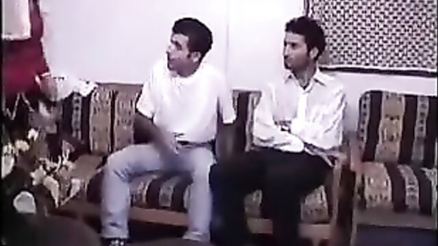 Two young Turkish men sitting clothed in Ayse Teyze widow chicks film