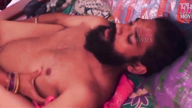 Indian bearded man nude on bed, woman's hand groping his cock in softcore tease