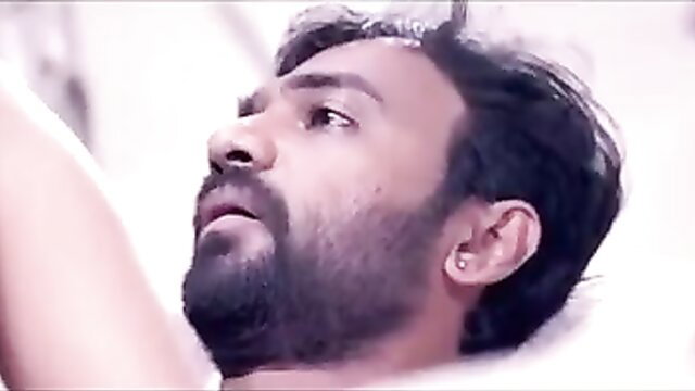 Handsome Desi man with beard in intense closeup gaze, hot web series sex scene