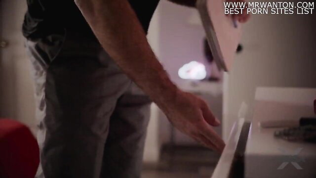 Man in suit reaches hand over table in Yes, Daddy MissaX scene