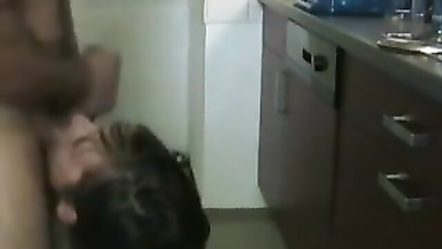 Amateur woman giving intense upside-down blowjob in kitchen, facial finish