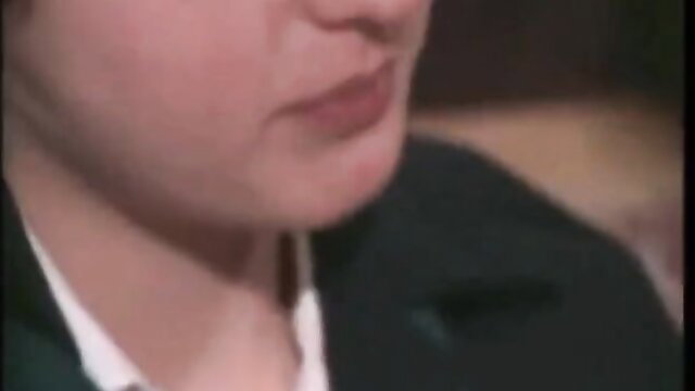 Closeup of mature woman's plump lips and face in black suit, teasing XXX thumbnail