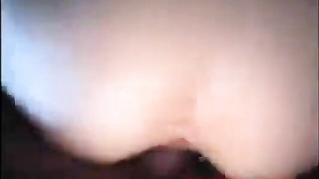 Blurry closeup of pale woman's huge tits and shaved pussy in amateur video