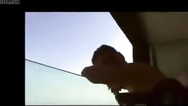 Silhouetted woman pressing huge tits on glass balcony, vacation tease