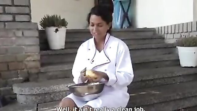 Brunette chef in white uniform holding messy bowl outdoors, cash fuck tease