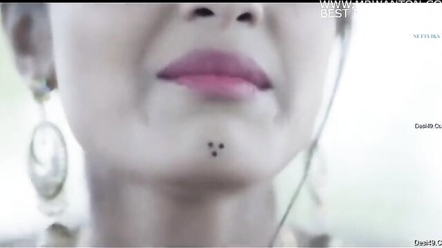 Closeup of Indian beauty's glossy lips and beauty mark in MUTHIYA S2E1