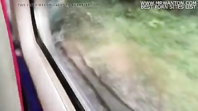 Blurry upskirt view of pale thighs and panties on crowded train