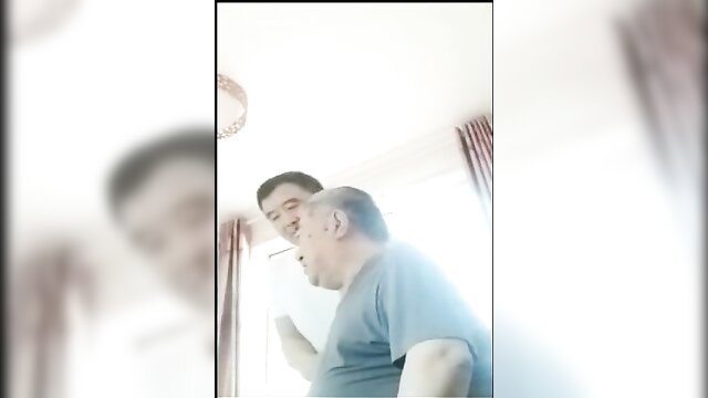 Chinese older man and chubby dad in intimate amateur gay encounter