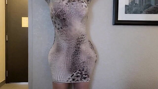Curvy chick in tight leopard print dress poses with huge hips and ass