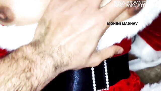 Indian bhabhi in Santa costume with a pearl necklace