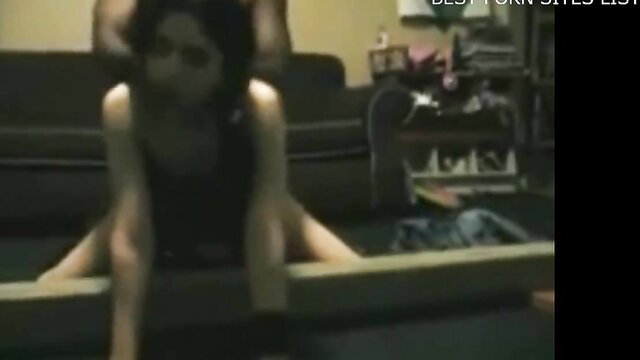 Asian slave girl bound spread eagle on floor in BDSM pose