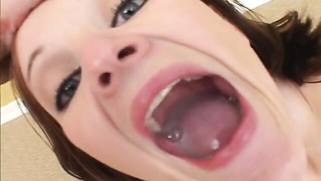 Closeup POV of hot brunette with mouth wide open, ready to swallow cum