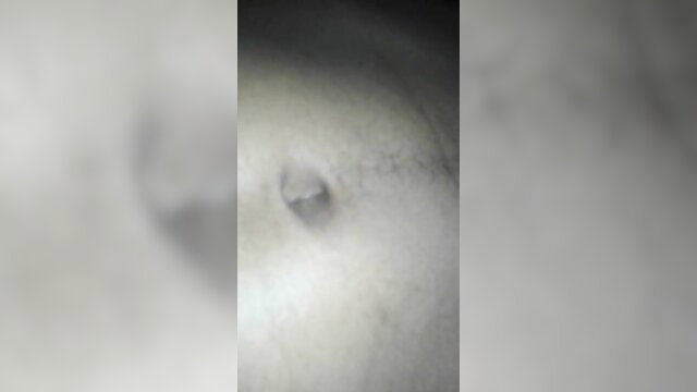Closeup of woman's pale nipple and areola in soft focus