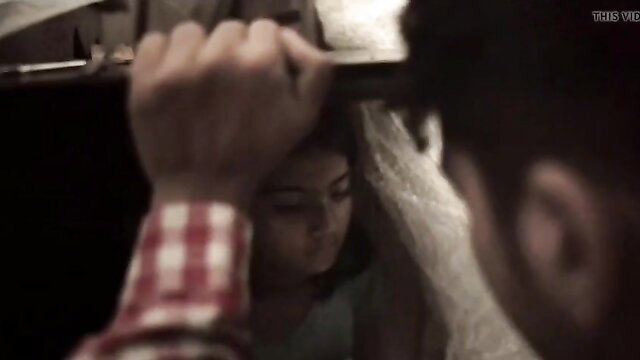 Man wrapping young Asian girl's head in plastic wrap closeup