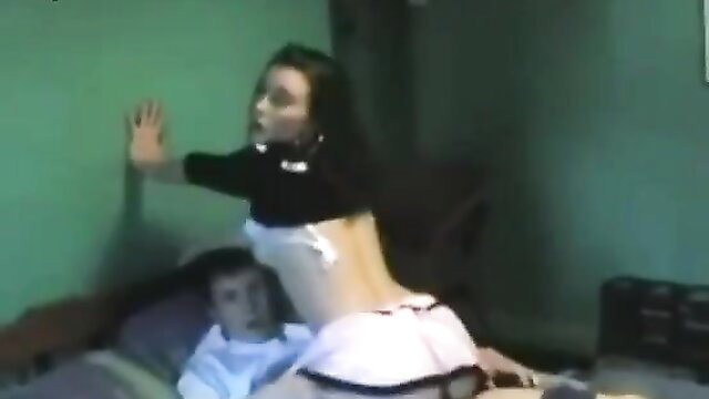 Brunette amateur teen in lingerie straddles guy on bed, explicit pose