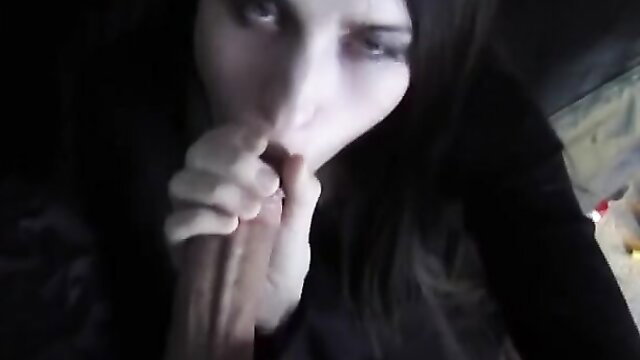 Pale goth angel with black hair gives deep fellatio closeup