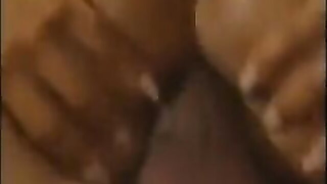 Blurry closeup of hands spreading big black ass for anal in vintage porn thumbnail
