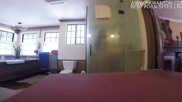 Amateur POV bathroom scene with nude woman in glass shower