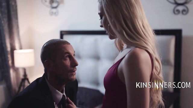 Bald suited man kisses busty blonde stepdaughter in red dress