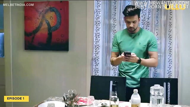 Handsome Indian guy in tight green shirt checks phone in Wife on Rent porn
