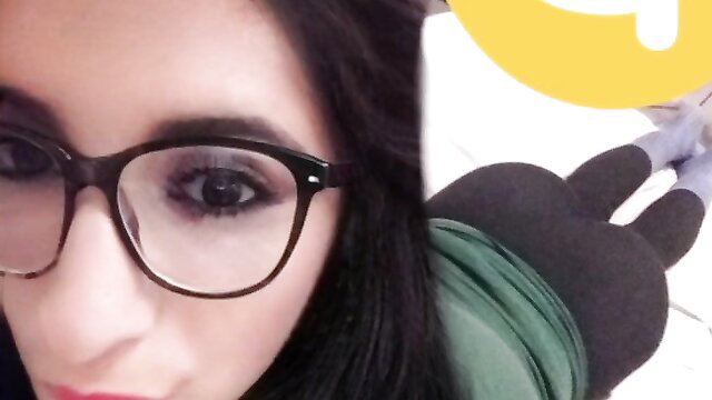 Latina brunette in glasses lying prone in tight leggings, big ass up