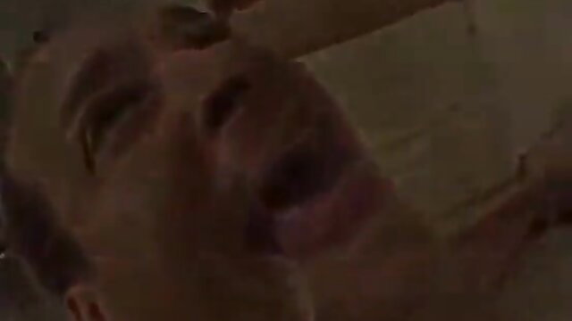 Closeup man grimacing mouth open in intense cum snowballing scene