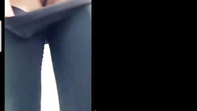 Ellie Leen poses with lifted skirt revealing tight ass