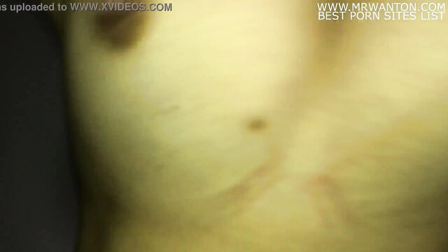 Blurry closeup of woman's yellow-tinted ass in anal sex scene