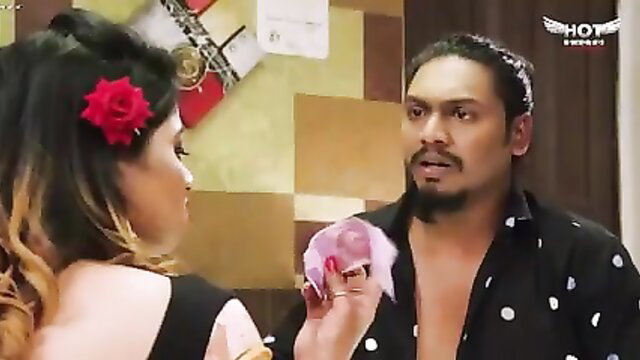 Indian college call girl in black dress holds pink panties with man