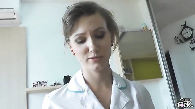 Sexy nurse in white uniform closeup, ready for treatment