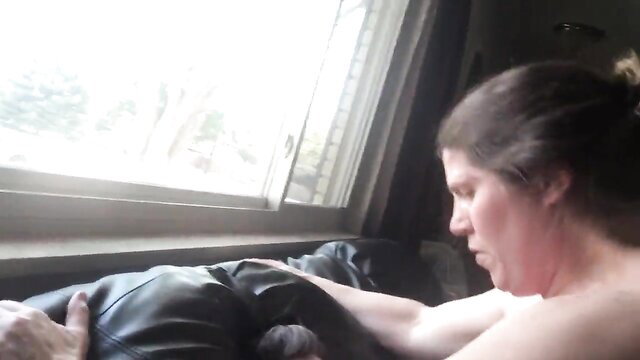 Camille nude by window in leather pants, neighbors watching