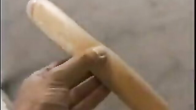 Hairy girl holds thick veiny dildo closeup in amateur porn thumbnail