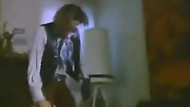 1972 retro blonde in leather vest bends over daybed in vintage porn