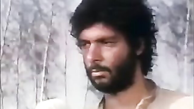 Bearded man in whipping scene from One Russian Summer adult film