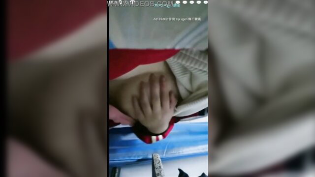 Asian teen Li Xinyue fingered under desk in classroom uniform POV
