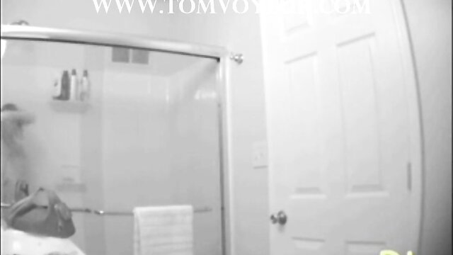 Spy cam of busty Amber showering nude in bathroom
